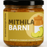 Homemade Grated Mango Pickle (Aam Ka Kuccha Achar) in a Glass Jar: Tangy and spicy grated raw mango pickle from Mithila Barni.