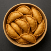 Homemade Gujiya in a Bowl: Sweet and flaky filled snack, a traditional treat popular in UP and Bihar region of North India by Mithila Barni.