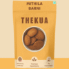 Homemade Thekua in a Bowl: Traditional sweet wheat cookies from Bihar, offered by Mithila Barni.